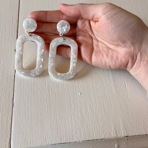 Dangling white earrings